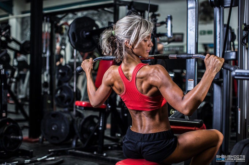 Lisa performing the wide-grip pull-down